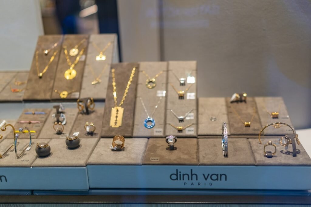 Gold and silver jewellery displayed in a modern boutique showcase