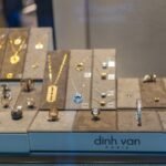 Gold and silver jewellery displayed in a modern boutique showcase