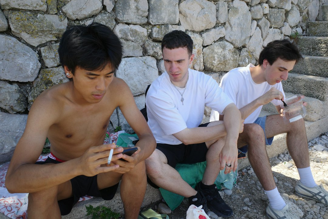 young men smartphone friendship