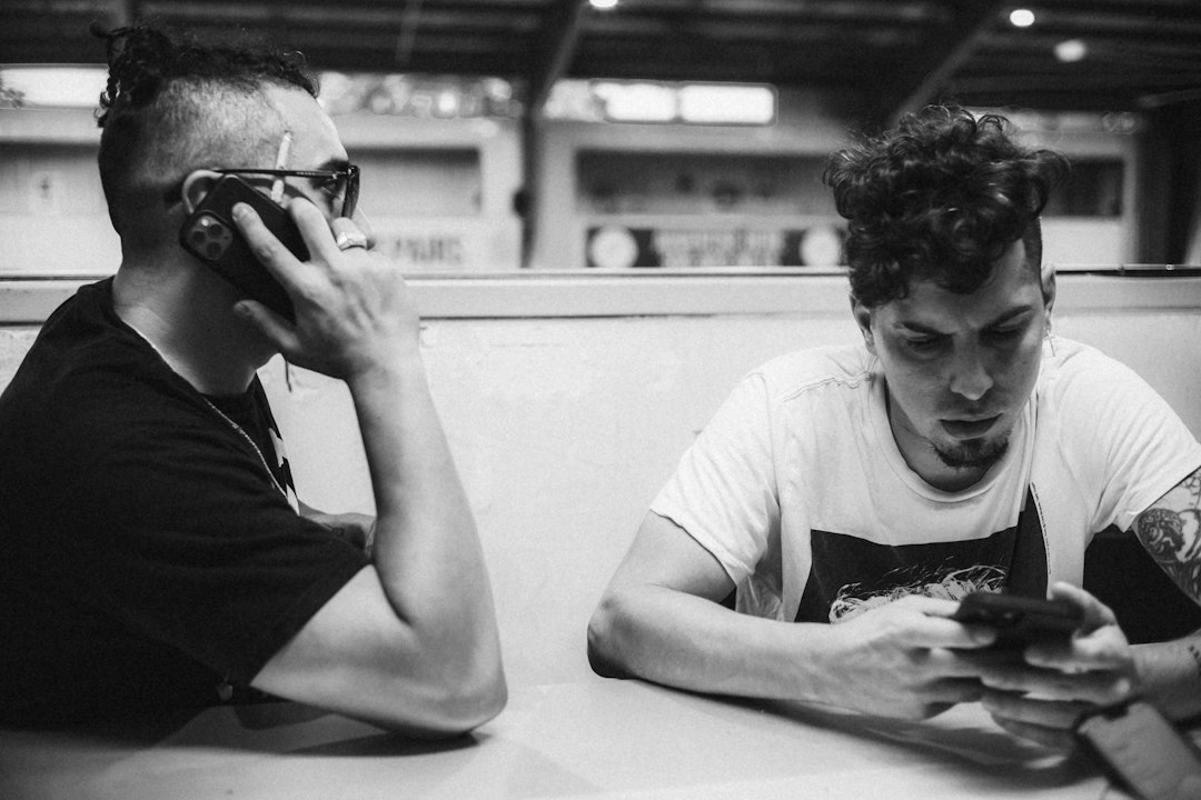 young men smartphone friendship