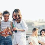 young men smartphone friendship